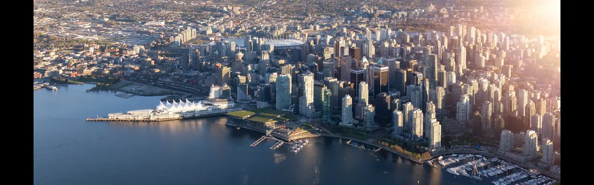 Wide view of downtown Vancouver, Stanley Park and Burrard Inlet from above
