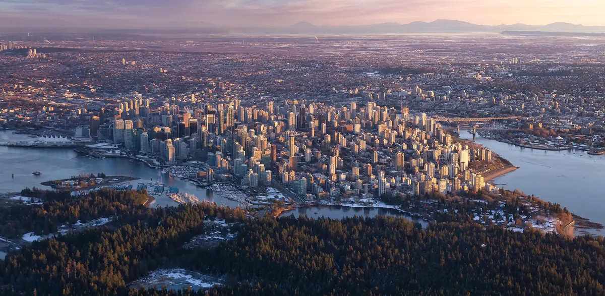 Downtown Vancouver skyline across the water at sunset