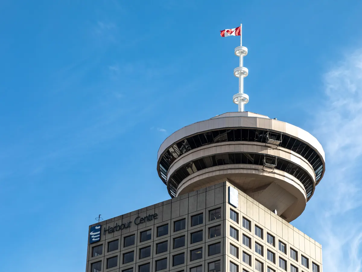 Harbour Centre tower and its circular lookout against a blue sky in downtown Vancouver