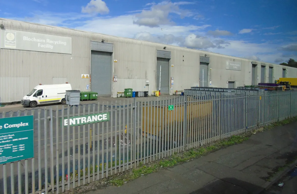 Sorted materials and buildings at a recycling facility