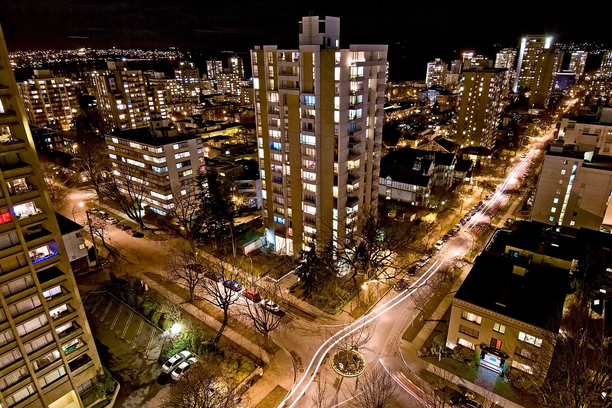 Apartment towers in Vancouver’s West End lit up at night